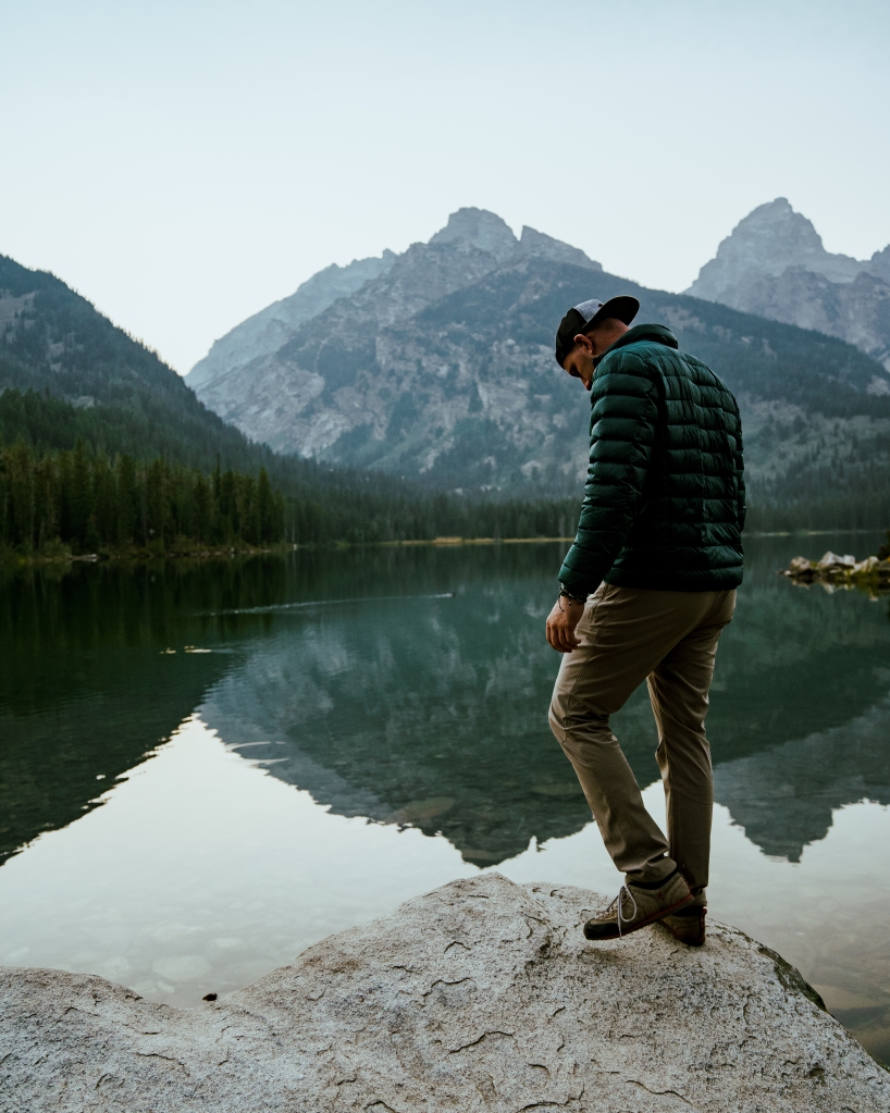 Hiker in front of Taggart lake, Teton National Park